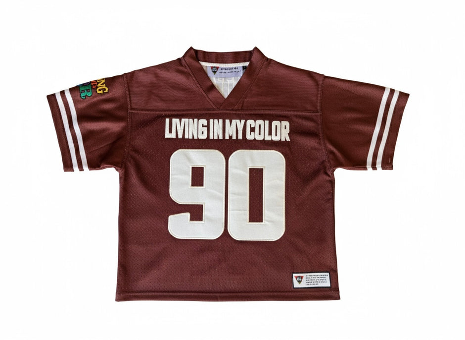 Brown sports jersey with 'Living in My Color' text and number 90 on a white background